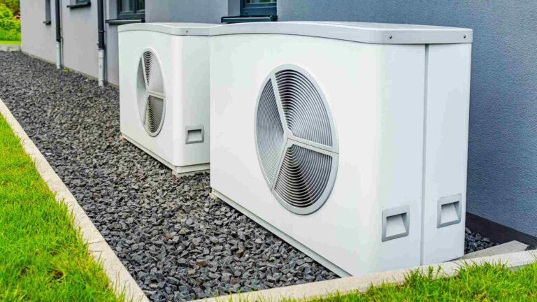 Two heat pumps outside of a building