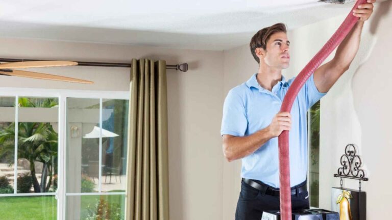 technician cleaning home ducts