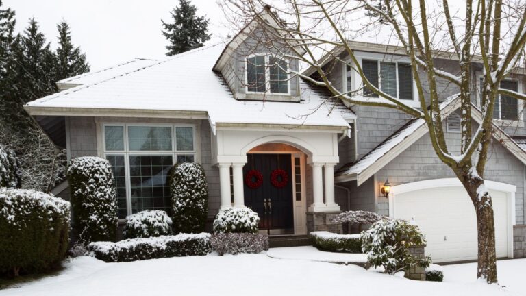 A snow-covered suburban house