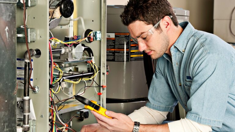 hvac technician repairing a furnace