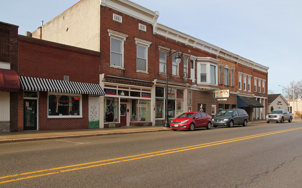 Street view of a row of brick buildings