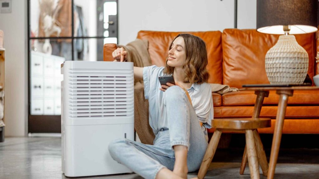 Woman Sitting near Air Purifier Appliance