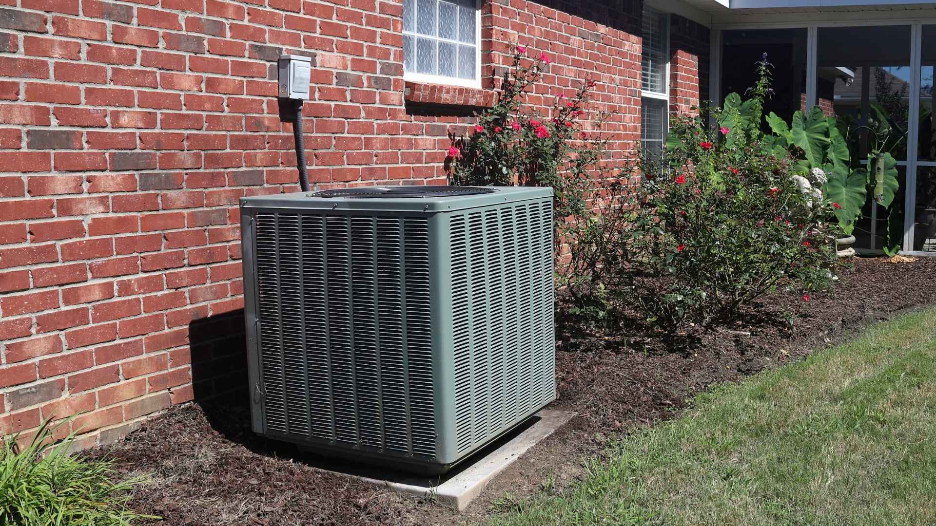 An undersized AC unit is installed on a concrete pad