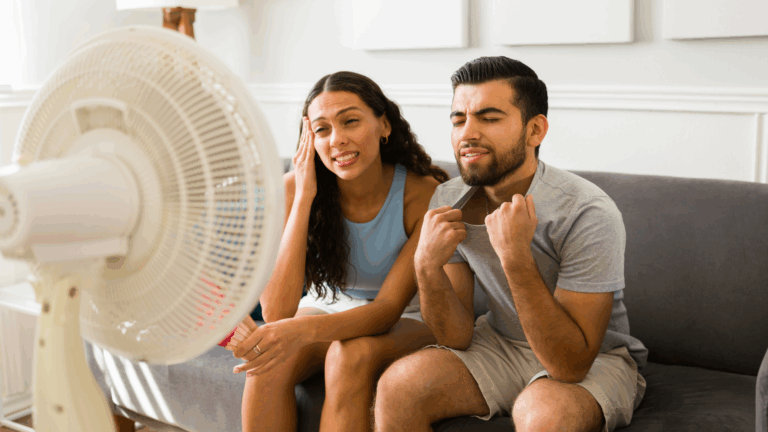 Woman and Man use fan to cool down instead of AC or dehumidifier