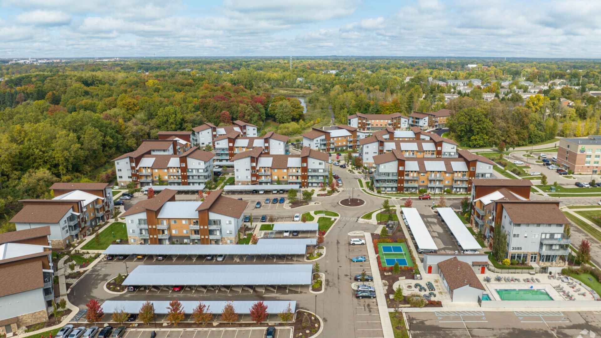 Aerial view of a modern apartment complex with multiple building